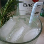 Mojito infused with rosemary simple syrup and garnished with a sprig!