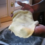 Yay!  A Peftectly made cornmeal pizza crust, ready to be topped.
