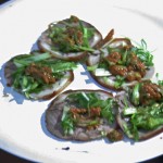 Pigs feed with scallions