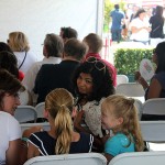 Arti Sequeira gives some attention to a couple of her young fans at THE TASTE 2011.