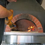 Pizzaiolo making a true Neopolitan wood fired pizza