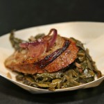 Bourdain sausage w/ collard greens, peppers and onions