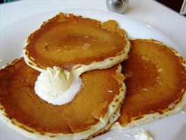 Three pancakes topped with ample butter at Ruby's.