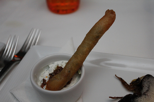 A kafta cigar with an "ashtray" of house made tzatziki sauce.