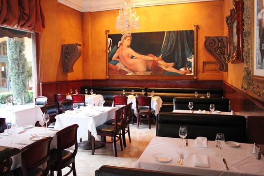The Stunning Main Dining Room in La Traviata Faces a Courtyard.  The Main Feature is a Huge Paintaing on the Far Wall.
