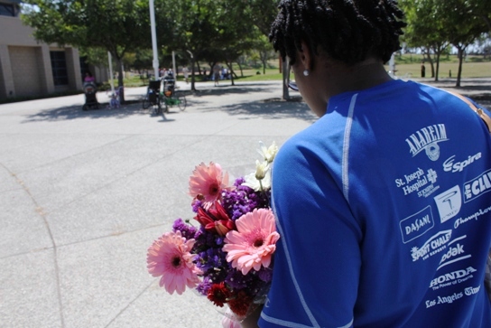 Nicole heading home with her flowers from the farmers market.