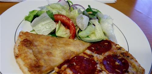 Serving a Fresh Salad with Newman's Own Four Cheese and Pepperoni Pizzas.