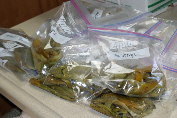 Once peeled and seeded, they are placed in Ziploc bags