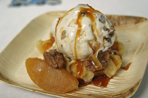 Belgian Liege waffle was topped with rum raisin ice cream and farmers market apples, caramel sauce and caramelized pecans