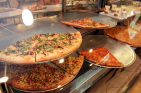 Ready-made pizzas ready to be eaten by the slice.