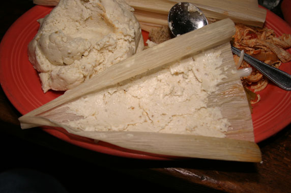 After the masa has been spread on to the corn husk