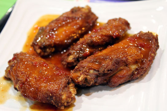 Crispy chicken wings flavored with one of the sauces. 