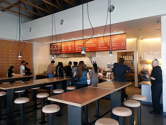 The inside is slightly smaller than the typical Chipotle, with communal tables as the centerpiece of the dining room