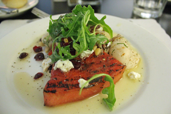 Grilled watermelon, pine nuts, California goat cheese, drived cranberries, arugula, honey, lemon, olive oil and baby calamari - Photo courtesy of Jamie Gall