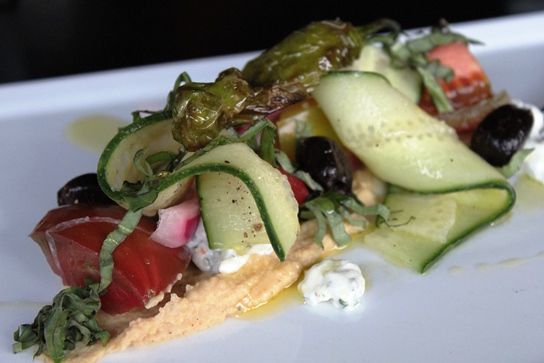 Greek Salad with tomatoes, cucumbers, feta, red onion, and olives.