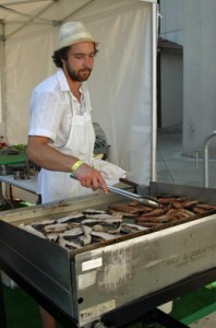 Chef at Short Order grilling pork belly AND bacon