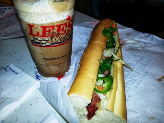 A large iced cafe mocha pairs nicely with a grilled pork banh mi, one of the most popular sandwiches at Lee's.