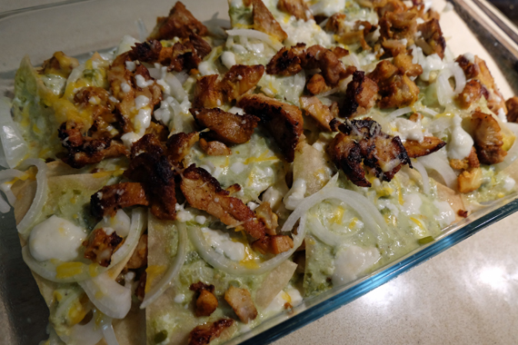 Homemade chilaquiles with grilled pollo asado,crema, queso fresco and tomatillo sauce