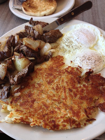 Marinated steak tips, hashbrowns, and eggs.