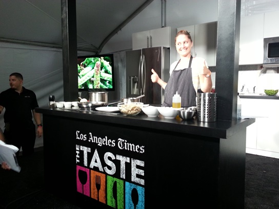 Chef Brook Williamson gives two thumbs up during a cooking demo at the 2013 LA Times The Taste.