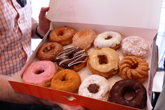 A dozen Dunkin' Donuts on display.