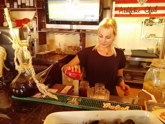 Pouring Coca-Cola is the first step in preparing a Kalimotxo.