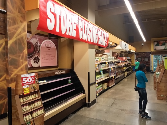 Shoppers look for deals inside the nearly empty F&E location in Manhattan Beach.