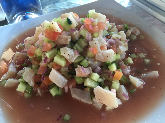 Ceviche de pescado - fish marinated w / lemon, cucumber, tomato & onion