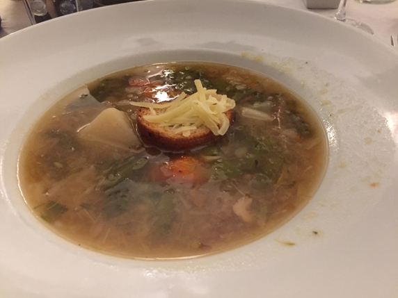 Potage Garbure soup - Hearty French soup with potatoes, haricot vert, smoked ham, carrots, celery and onions