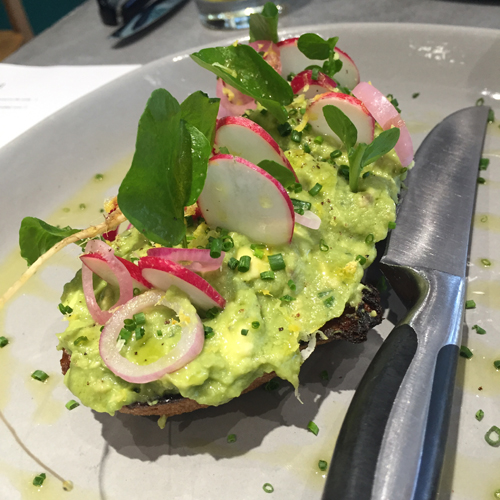 Avocado Toast with scallions, fresno chiles and radishes