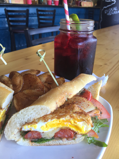 The Boardwalk: Plancha grilled Txistorra sausage, arugula, sliced tomatoes and espelette aioli with a fried egg.