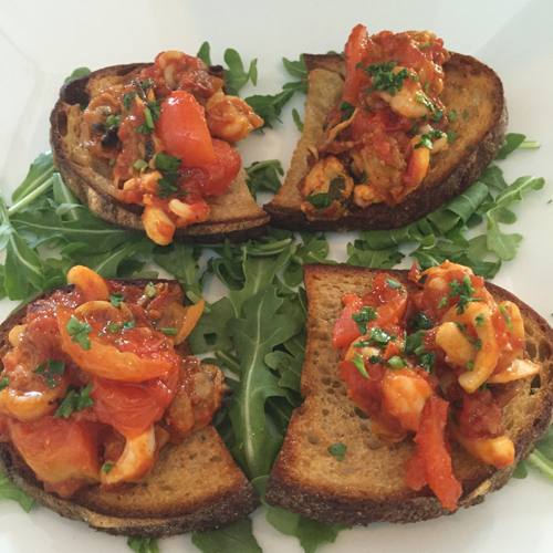 Crisp crostini topped with an assortment of fresh clams, mussels, shrimp and calamari