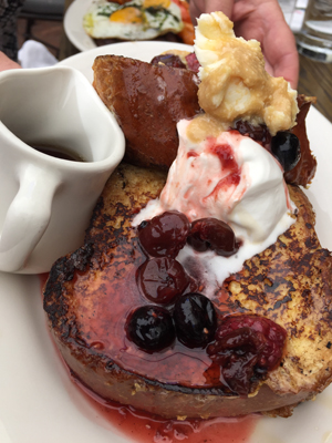 Vanilla bean french toast topped with mixed berry compote