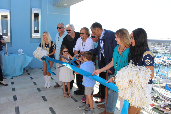 Honored guests joined the proprietor of Shade Hotels, Michael Zislis, center, in cutting the ribbon for Shade Hotel Redondo on Sunday, October 2, 2016.