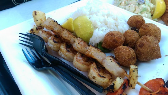 Grilled shrimp with rice and hush puppies.