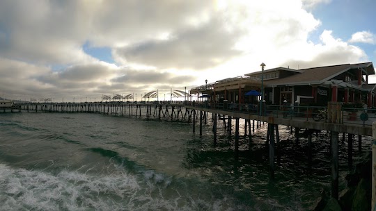 The sun setting behind Kincaid's and the Redondo Beach Pier.