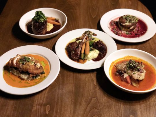 The entrees include a choice of Pan Seared Pacific Sea Bass, Braised Short Rib Osso Buco, Herbed Goat Cheese Stuffed Breast of Chicken.
